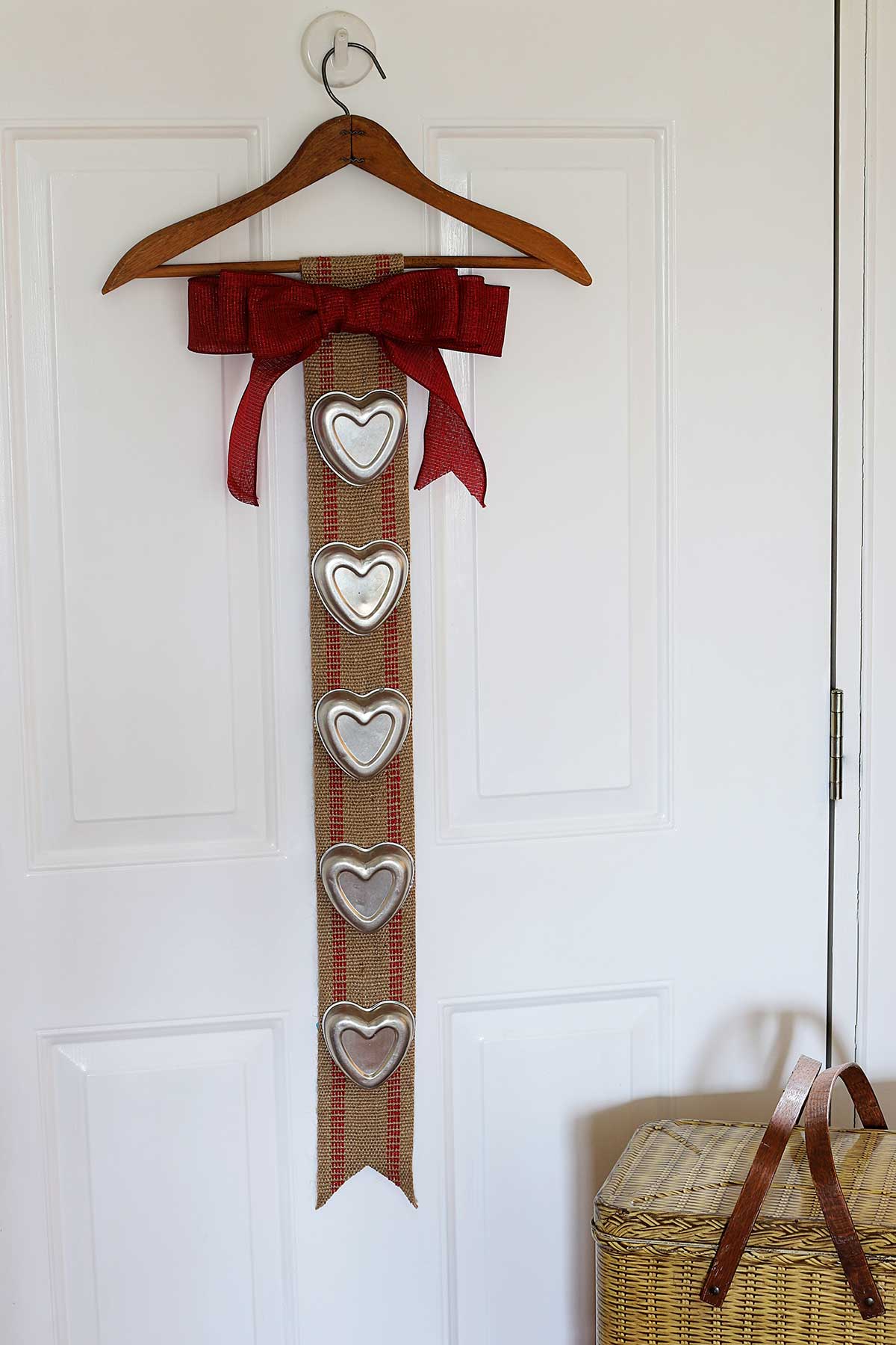 tin heart upcycled Valentines Day banner using upholstery webbing and vintage jello molds