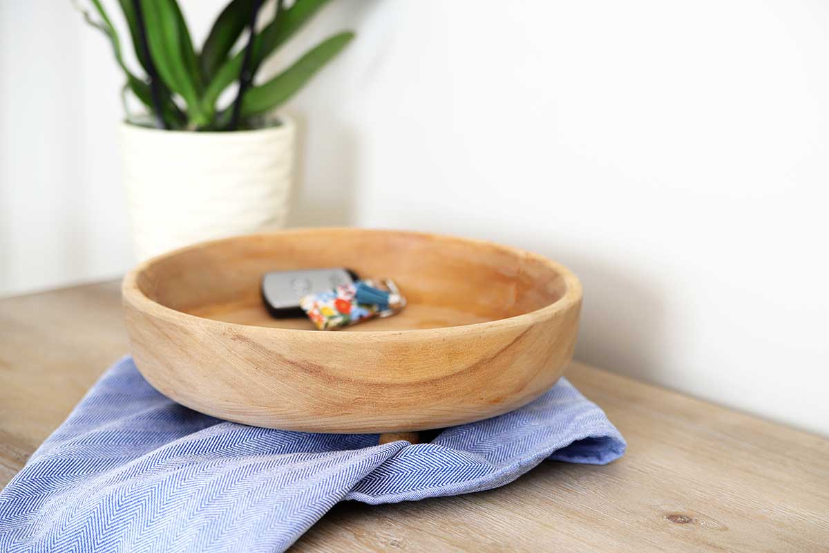 Bleached monkey pod bowl sitting on counter