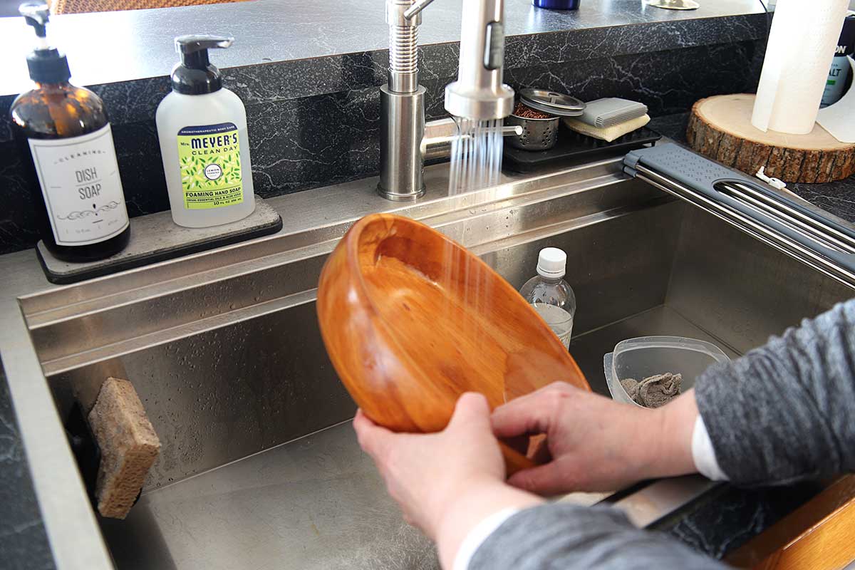 Using water to rinse wooden blow that has been bleached