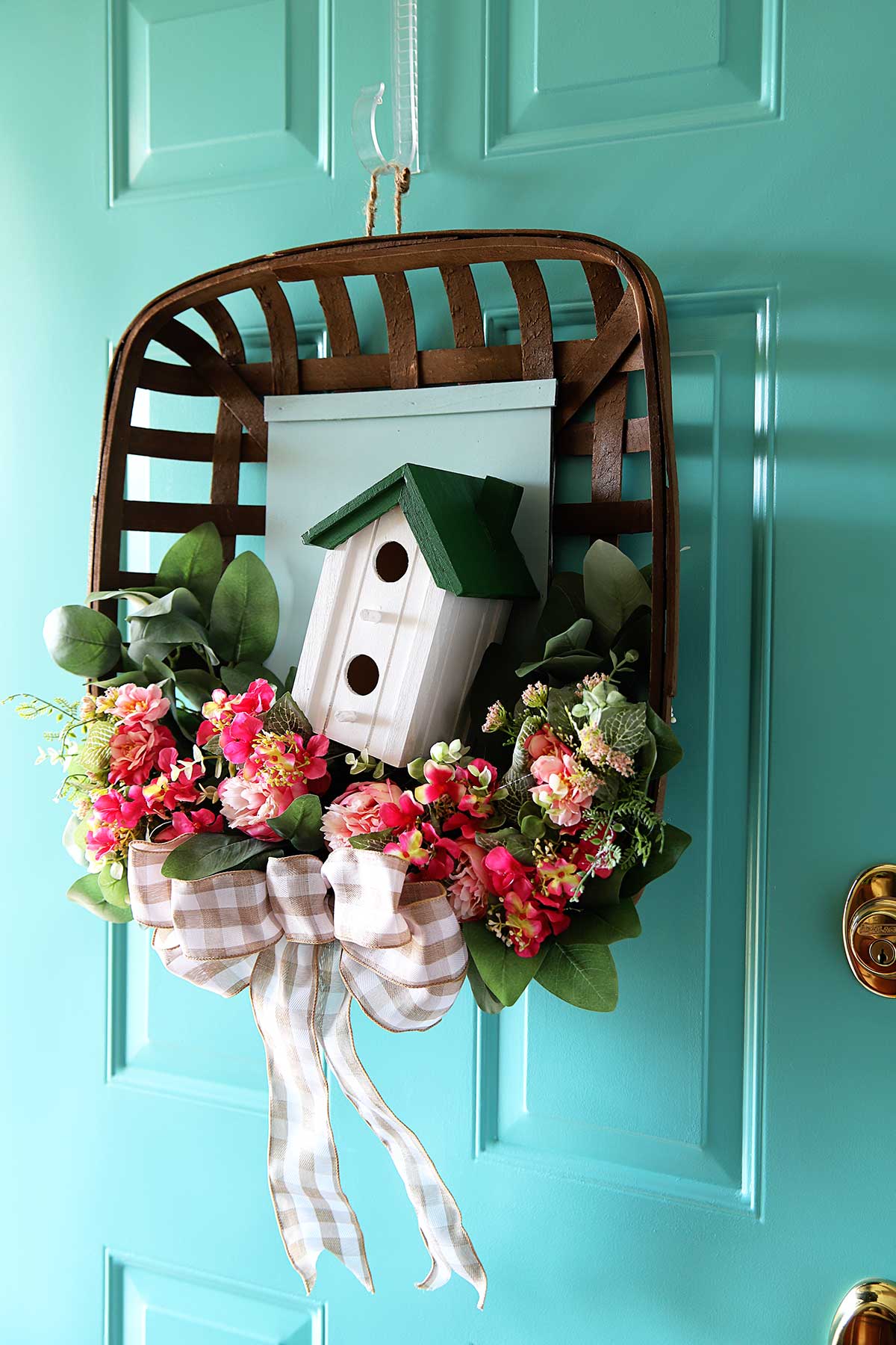 tobacco basket wreath hanging on the front door