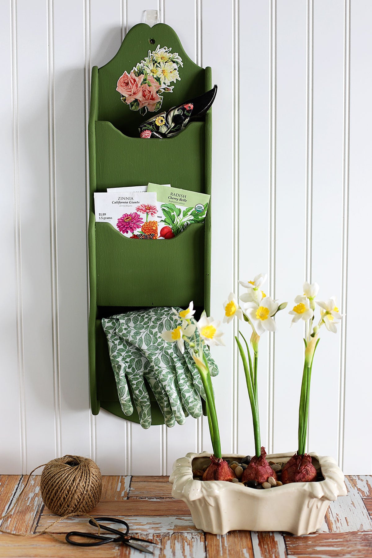 Upcycled garden tool organizer made from a wooden mail organizer from the 1970's.