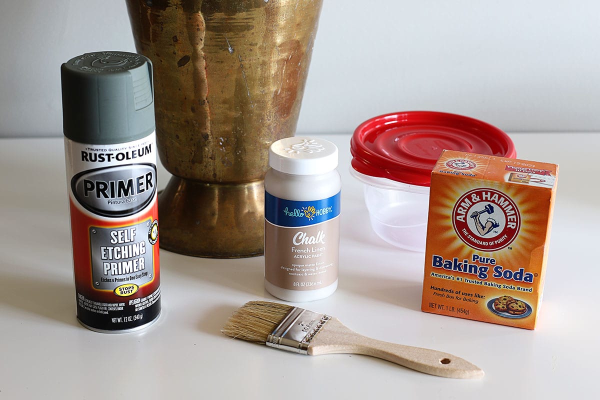 Supplies needed to make baking soda paint - baking soda, chalk, latex or acrylic paint, bowl, paintbrush, spoon or stir stick, primer if painting over metal.