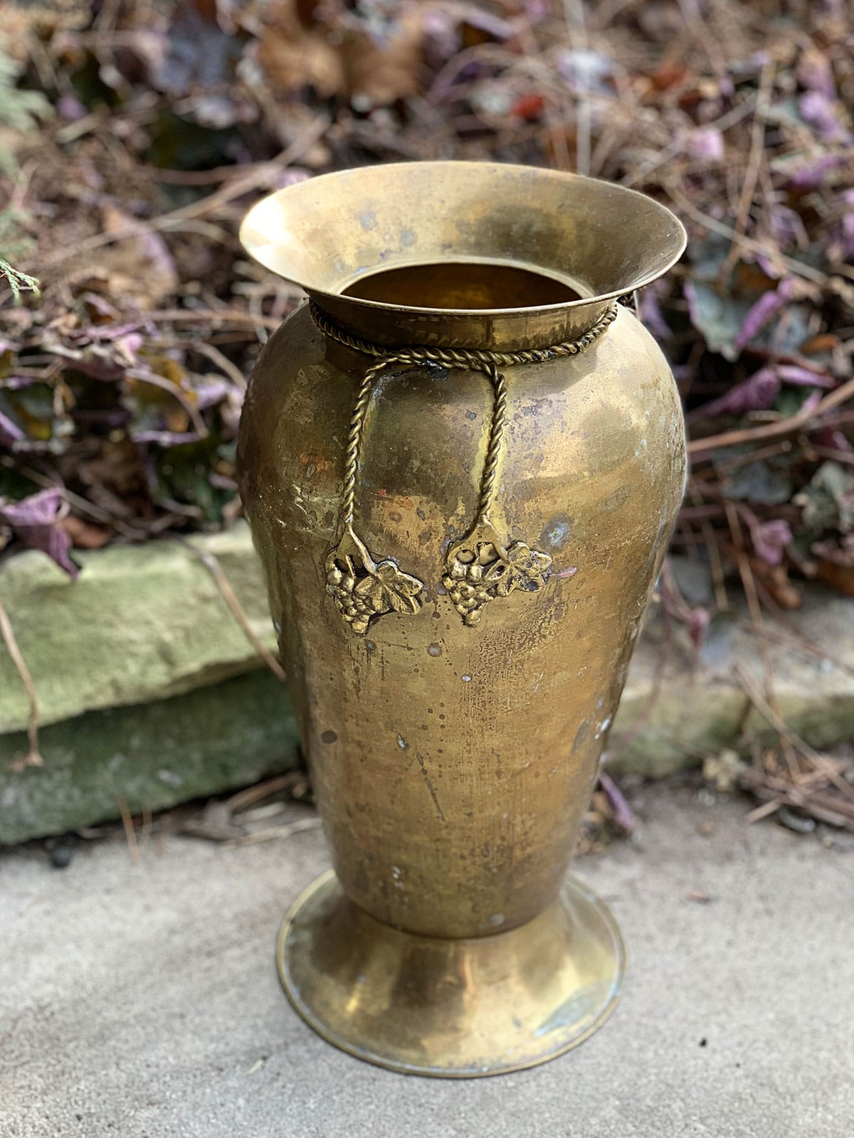 Large brass vase being upcycled into pottery using baking soda paint technique.