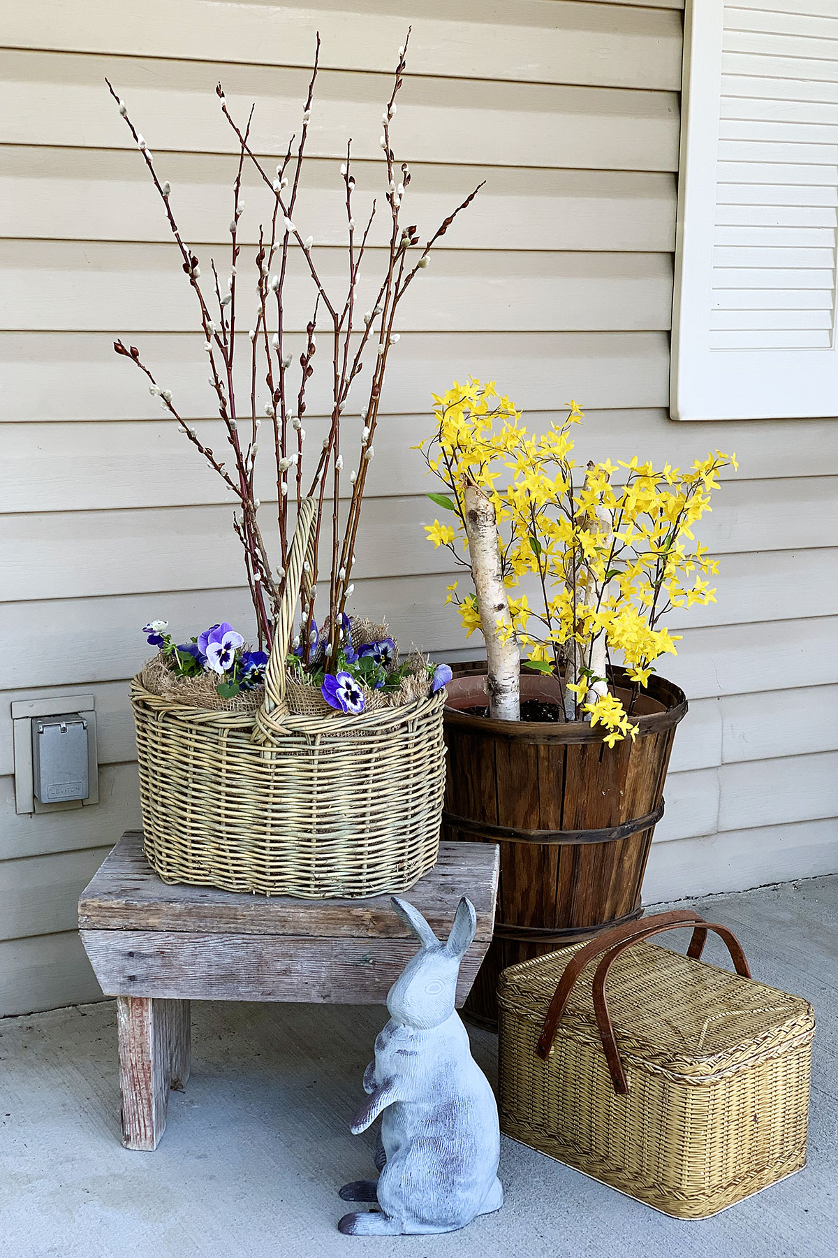 Pansies planted in a basket on the porch.