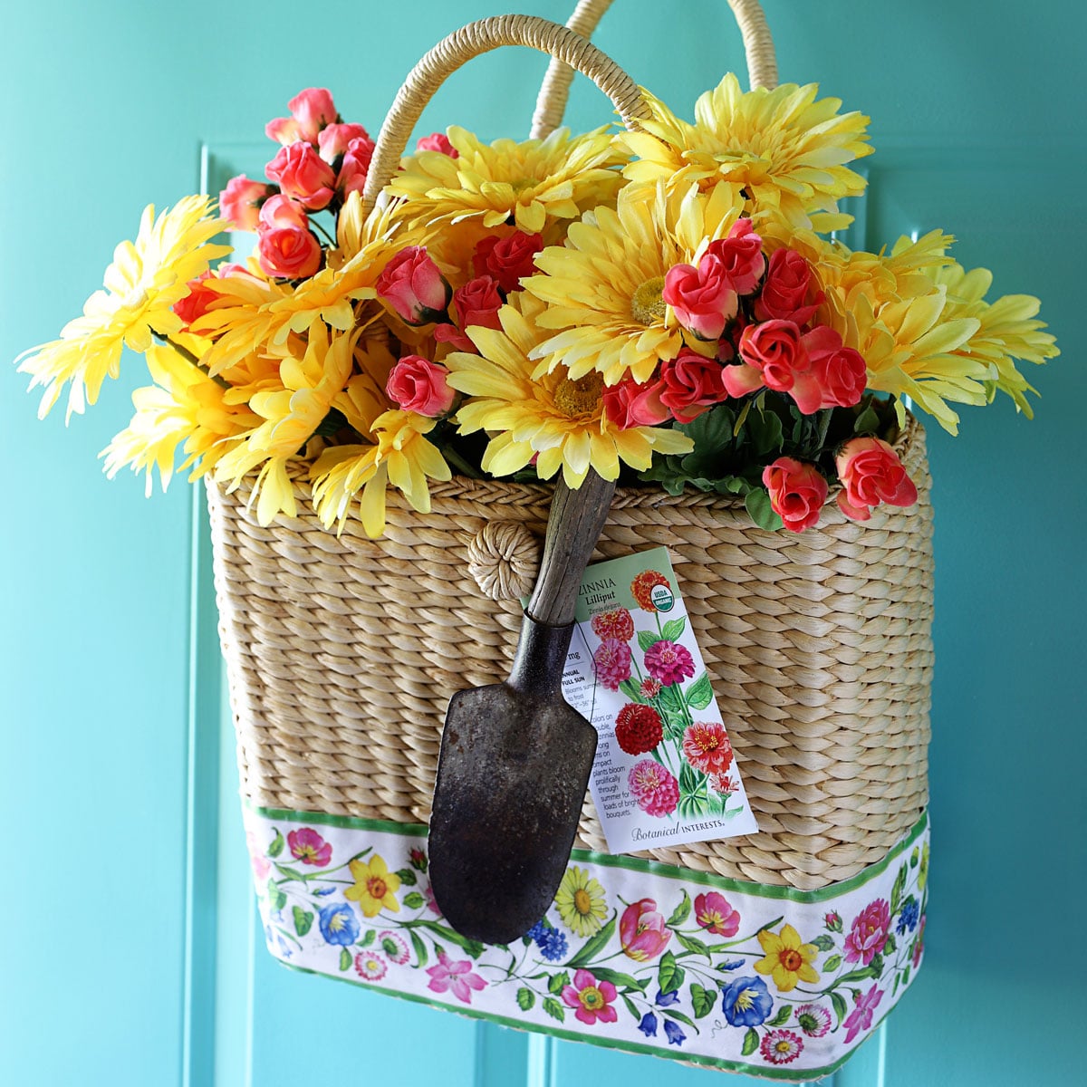 Straw purse repurposed into a door wreath.