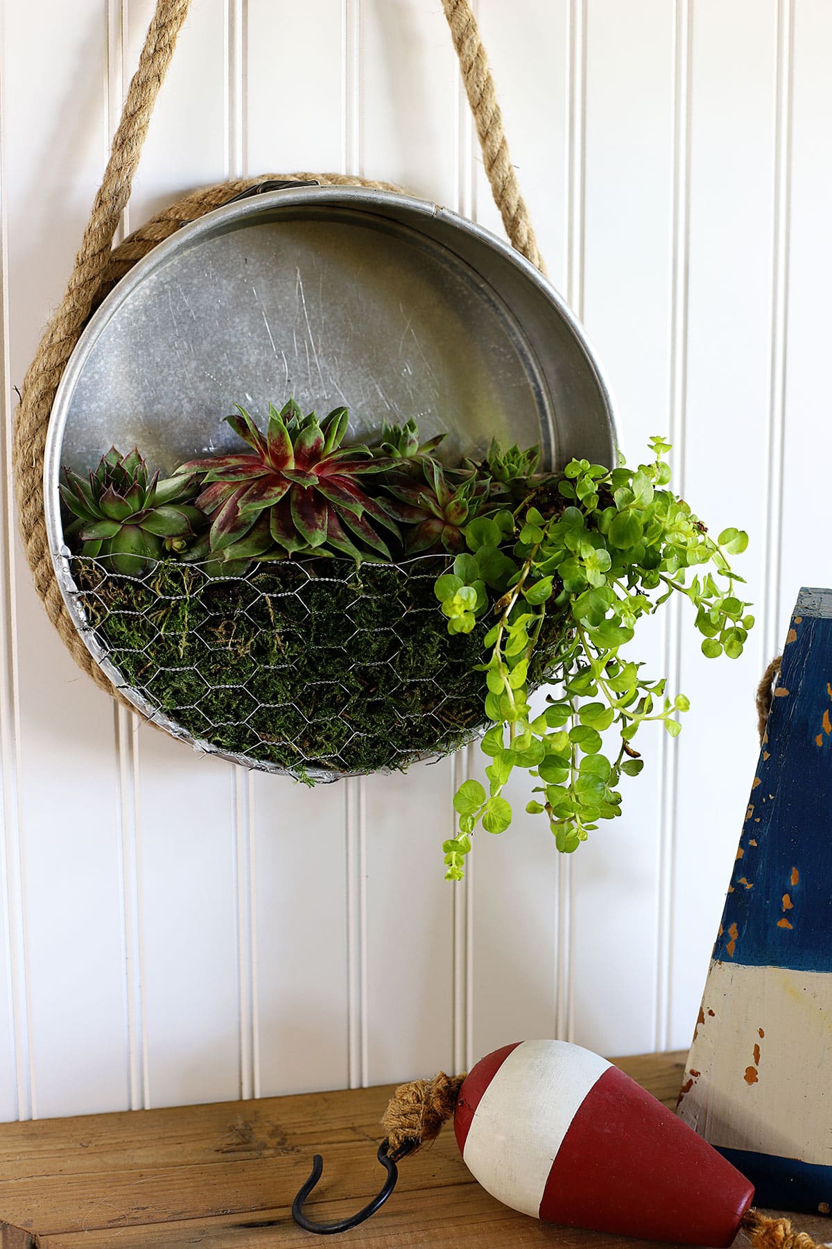 Learn how to repurpose a thrift store staple - the springform cake pan - into a nautical farmhouse style planter! Quick & easy thrift store makeover.