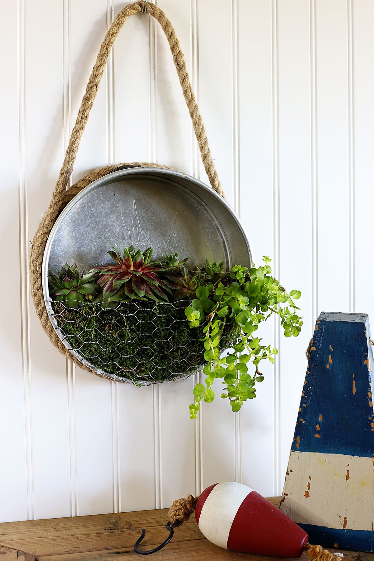 Learn how to repurpose a thrift store staple - the springform cake pan - into a nautical farmhouse style planter! Quick & easy thrift store makeover.