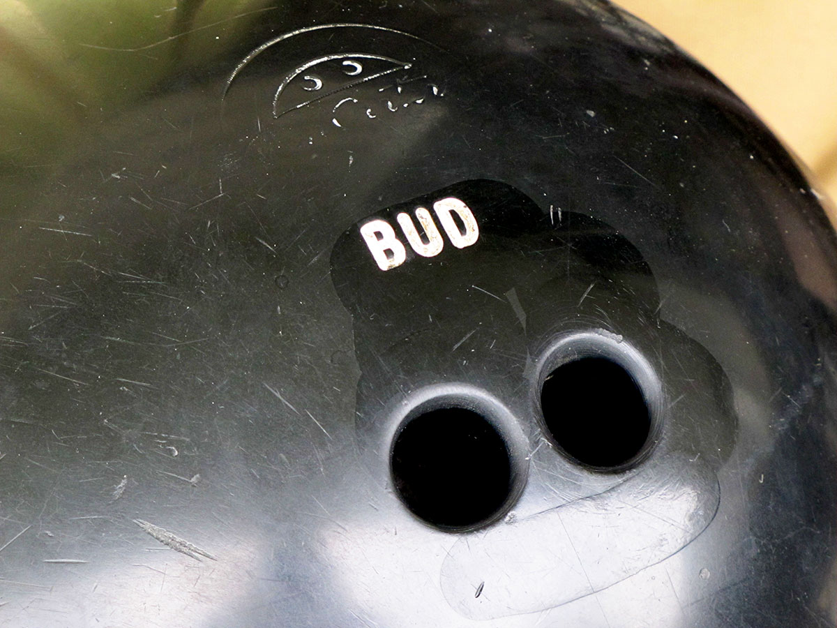 Close up of the holes in a bowling ball.