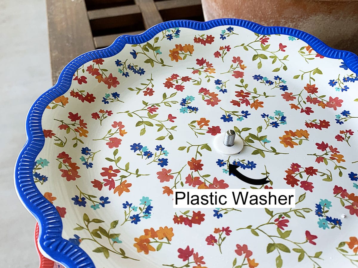 Put another plastic washer on top of the plate.