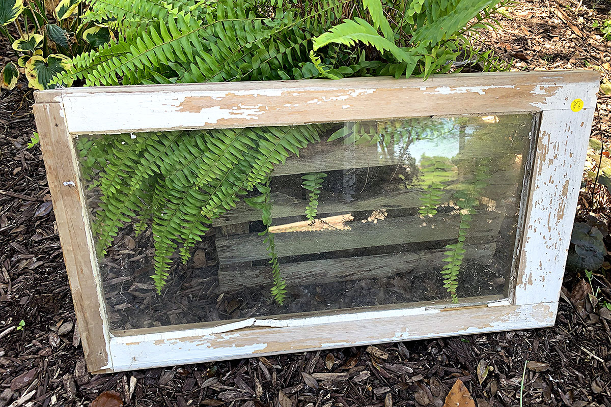 Wooden window being used in an upcycled arts and crafts project.