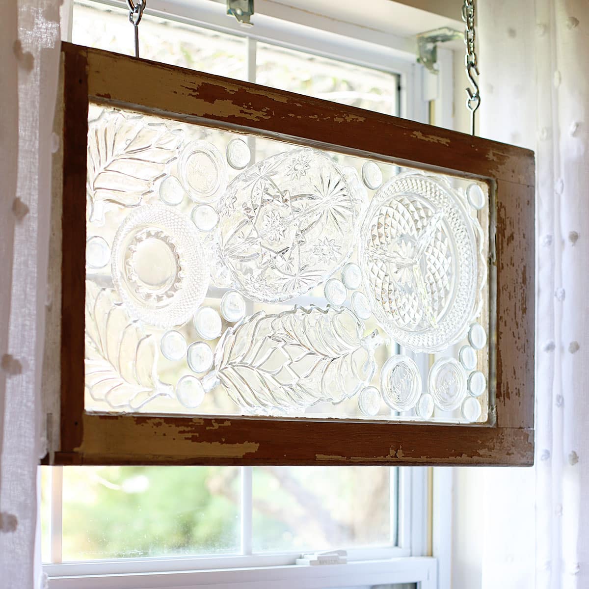How to make window art with glass plates from the thrift store for a mosaic look.