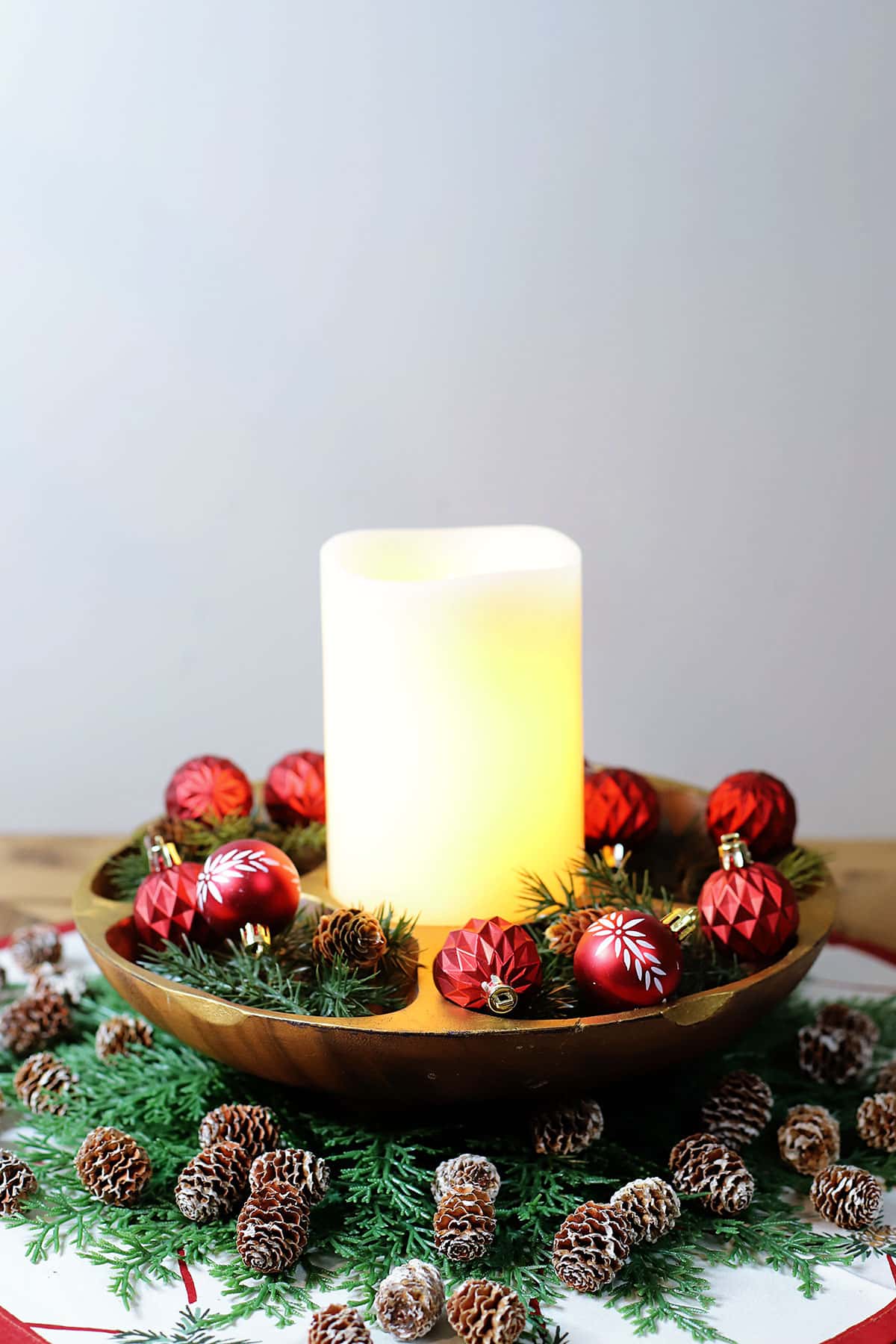 Mid century modern serving bowl upcycled into a Christmas candle holder centerpiece.