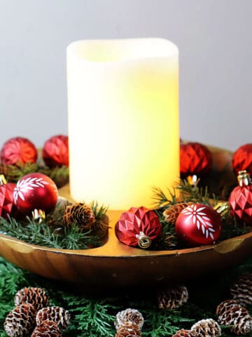 Vintage wooden bowl from the thrift store is made into a festive Christmas centerpiece.