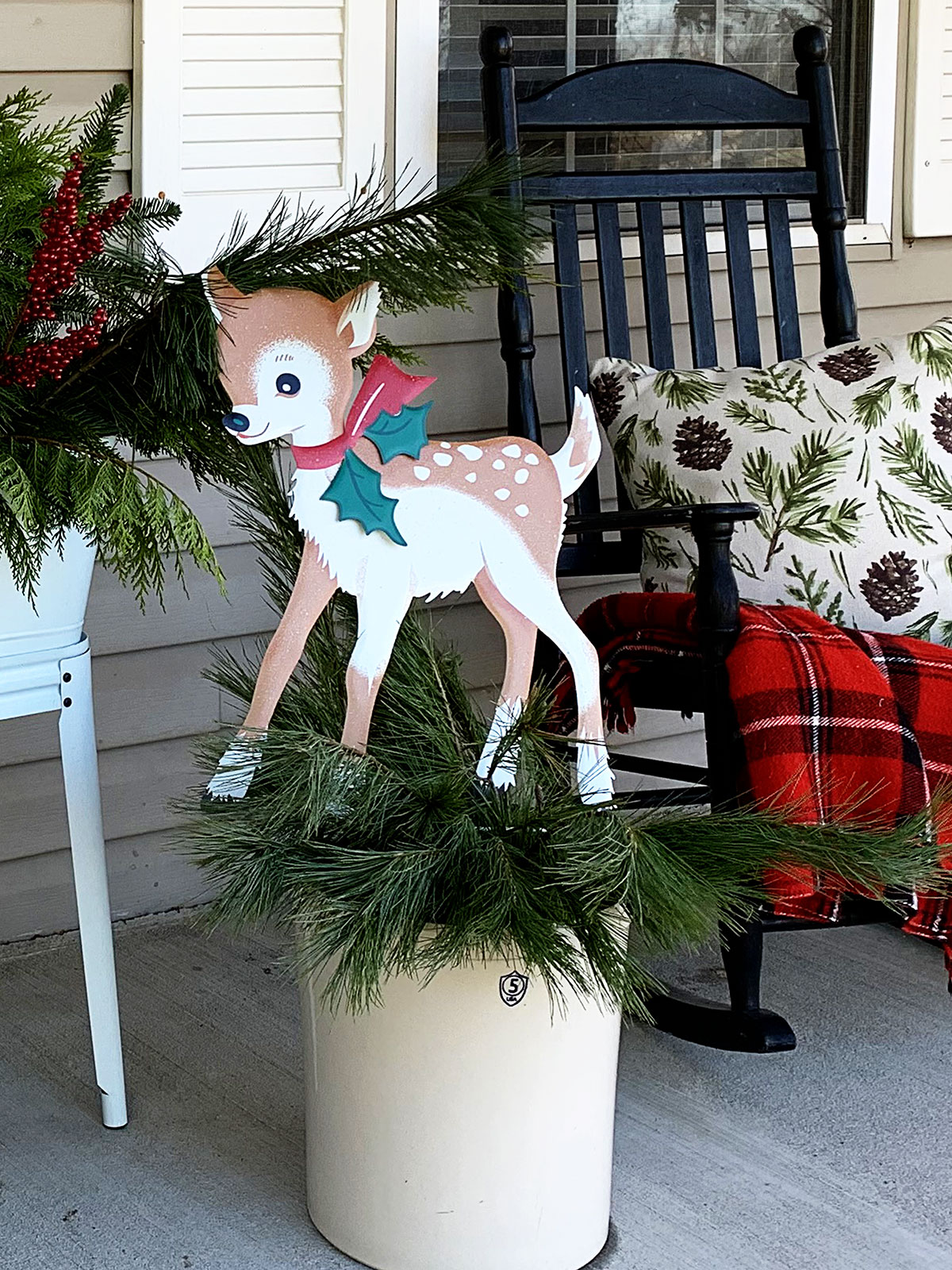 Retro looking reindeer used as Christmas porch decorations.