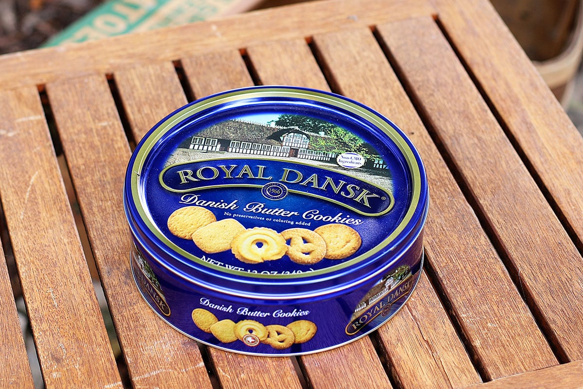 Royal Dansk danish butter cookies tin repurposed into a bird feeder.