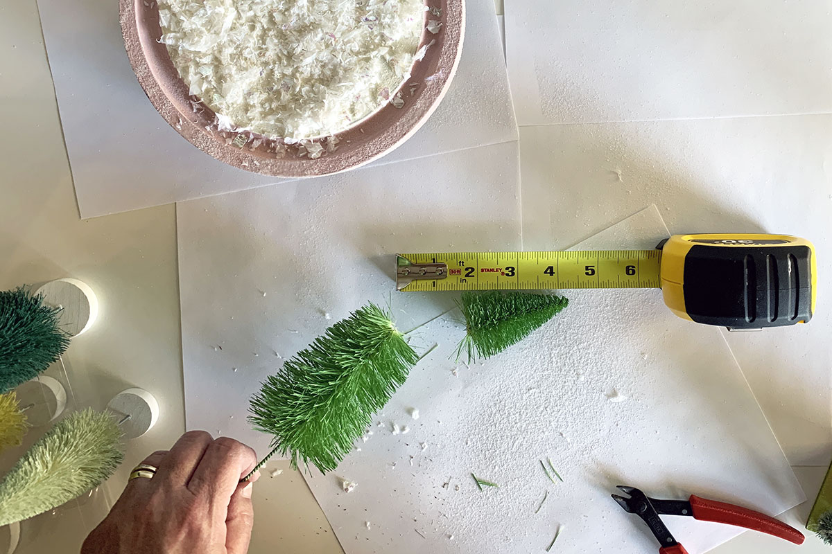 Cutting down the sisal trees to fit in the cheese dome.