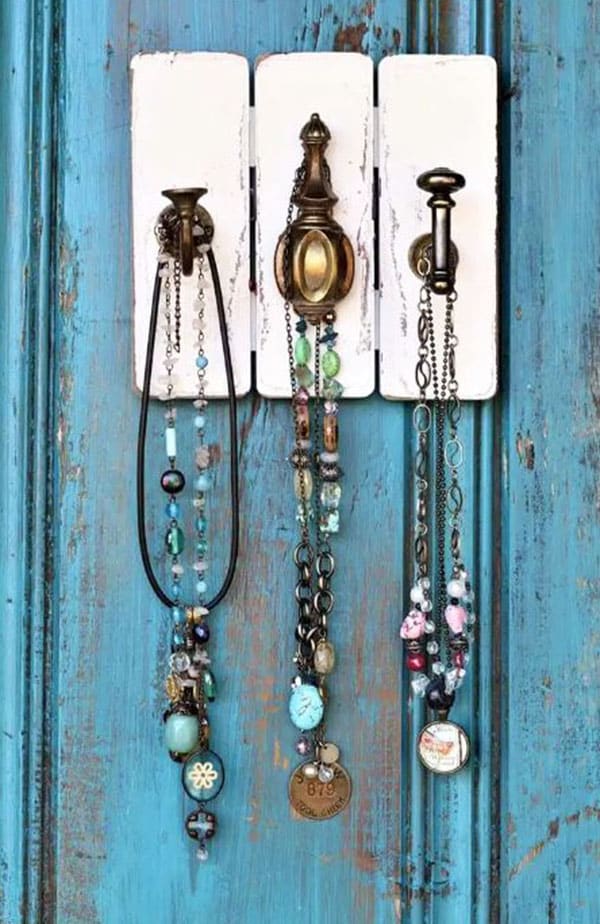 Jewelry hanging from hooks.