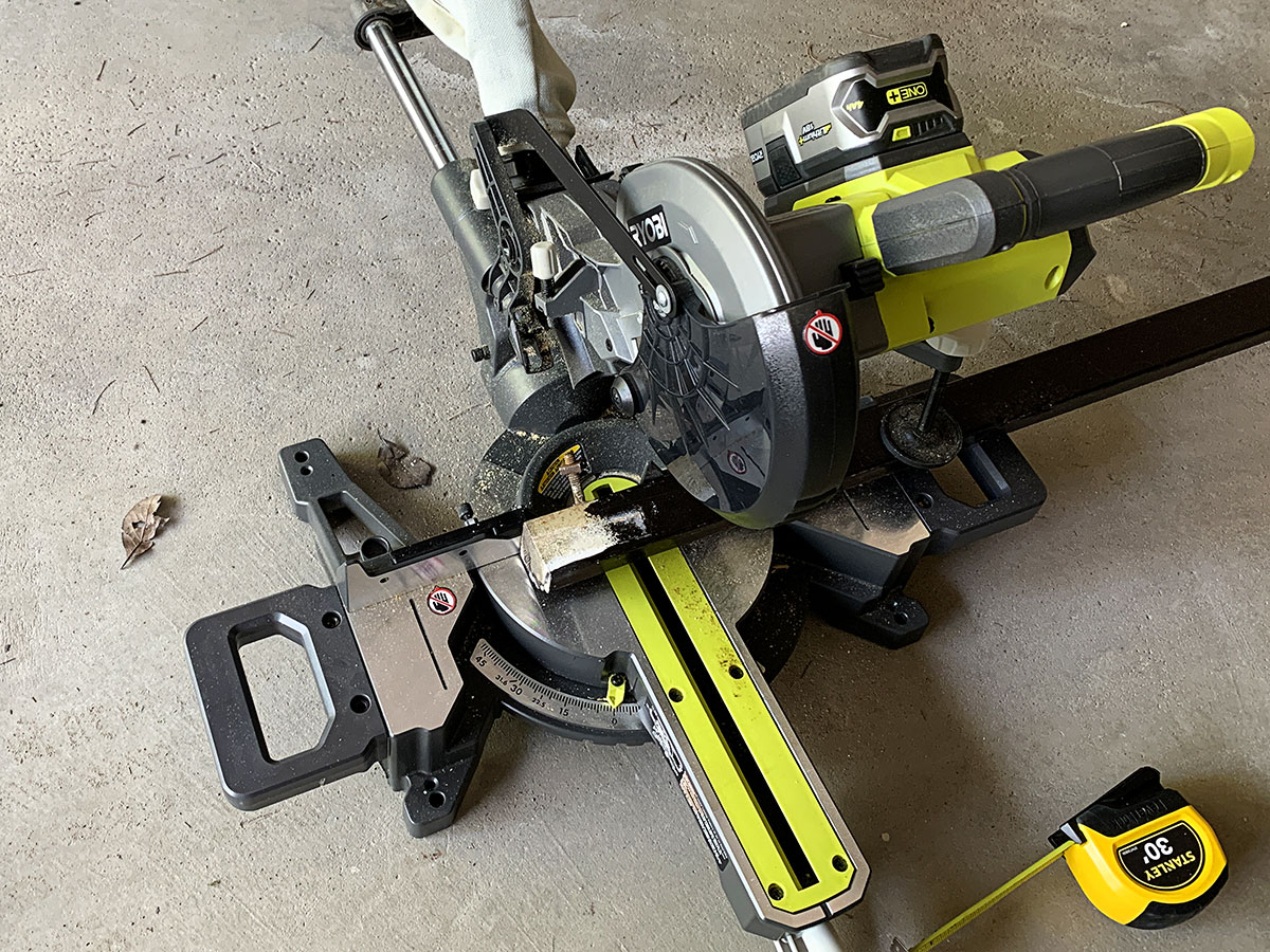 Cutting table legs down to size with a miter saw.